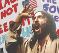 Jesus Christ leads a protest against health care reform.