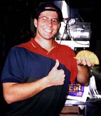 Taco Bell employee Jason Hendrix holds up the prototype for the new Chihuahua-lupa.