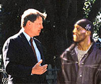 Presidential Candidate Al Gore speaks with rapper DMX outside on the rapper's home in New York.