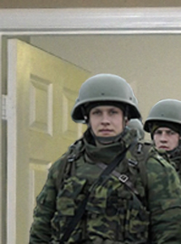 Russian soldiers wait outside Timmy Couch’s bedroom door.