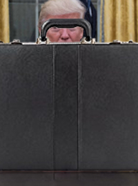 President Donald Trump stares at a briefcase that he refuses to admit that he can not open.