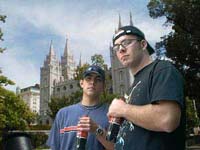 Jacob Hensdale and Mark Richards stand outside the Mormon temple in Salt Lake City defiantly, with Cokes in hand. 