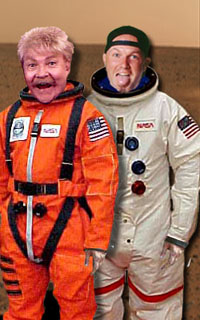 Singer Fred Durst and comedian Rip Taylor pose for photographers in their NASA issue space suits.