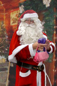 Santa Claus is seen decorating a fake Prada bag in this undated photo.