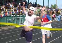 Jason Odenbaum finishes first in the 100 meter dash at this year's Special Olympics.